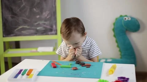 The boy sculpts from plasticine Stock Footage 220418847