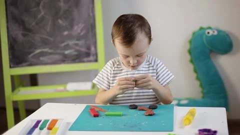 The boy sculpts from plasticine Stock Footage 220418848