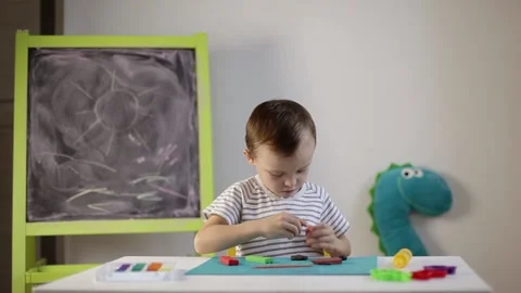 The boy sculpts from plasticine Stock Footage 220418855
