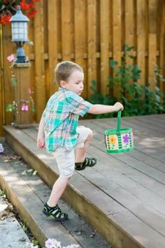 Boy Searching for Easter Eggs Stock Photos
