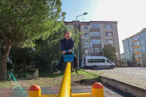 Boy on Seesaw Stock Photos