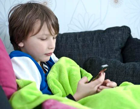 Boy sending text message Stock Photos