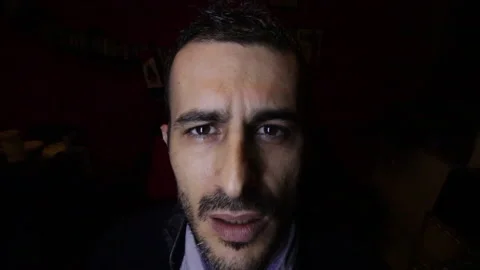 Boy with serious expression isolated on black Stock Footage 132617658