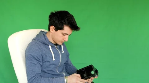 Boy sets and wearing VR glasses - green screen Stock Footage 61473390