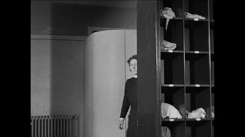 Boy settles himself in the new boarding school facilities, UK 1944 Vídeos de archivo 139236963