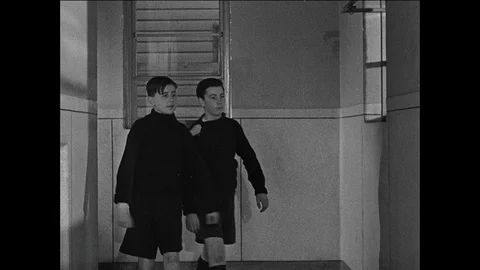 Boy settles himself in the new boarding school facilities, UK 1944 Vídeos de archivo 139237025
