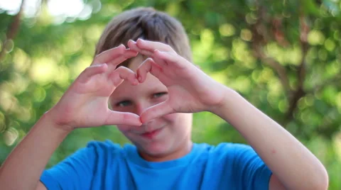 Boy Shape Heart On His Eye Stock Footage 40671158