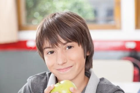 Boy sharing a apple Stock Photos