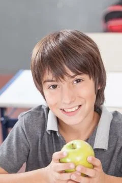 Boy sharing a apple Stock Photos