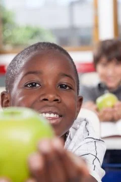Boy sharing a apple Stock Photos