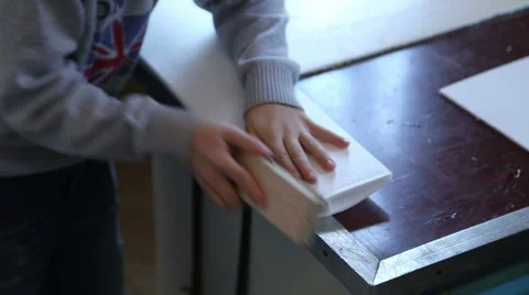 The boy is sharpening with sandpaper wing airplane model Stock Footage 59113244