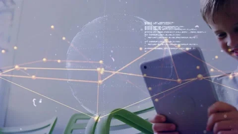 Boy shifting tablet into center, activating wireframe globe overlay while Stock Footage 321782784
