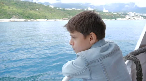 The boy on the ship in windy weather Stock Footage 64175096
