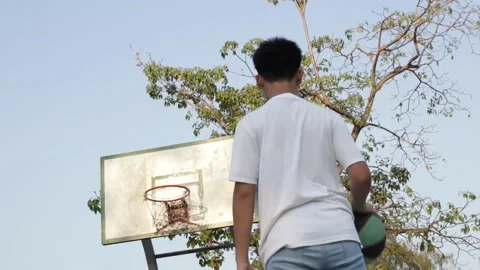 A boy shooting a ball Stock Footage 104744973