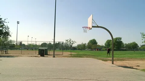 Boy shoots basket static wide Stock Footage 22214645