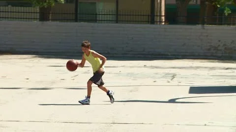 Boy shoots basket tracking Stock Footage 22214517
