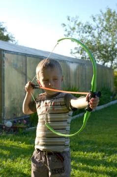 The boy shoots from bow Stock Photos