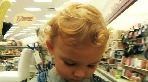 Boy in shoping cart Stock Footage 11152927