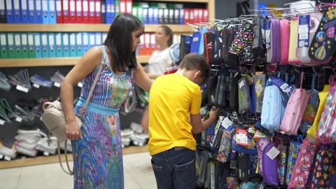 Boy Shopping For Back to School Stock Footage 135987203