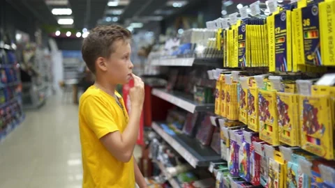 Boy shopping for back to school Stock Footage 139045598