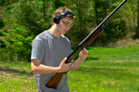 Boy with shotgun Stock Photos
