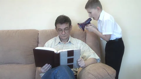 Boy shouting into a megaphone with the requirement to pay attention to it. Stock Footage 48376114