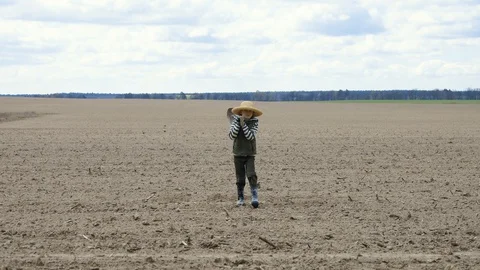 Boy with a shovel going in the field Stock Footage 128911987