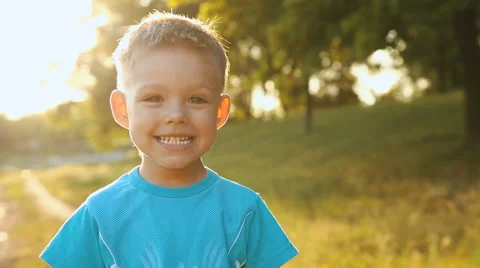 Boy showing his teeth to the camera Stock Footage 60736842