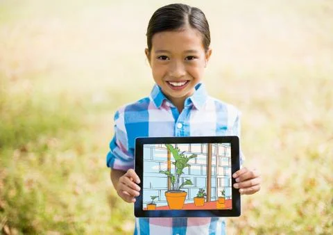 Boy showing the house with tablet 写真素材