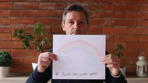 Boy showing a rainbow with African text EVERYTHING WILL BE OK Video stock 129180987