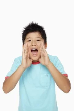 Boy showing a shouting gesture Stock Photos