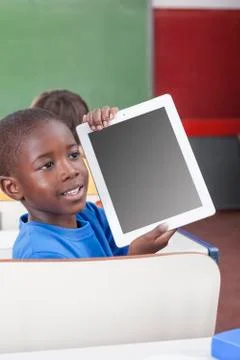Boy showing the tablet 写真素材