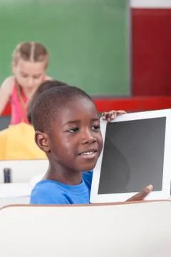 Boy showing the tablet 写真素材
