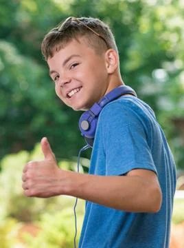 Boy showing thumbs up Stock Photos