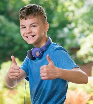 Boy showing thumbs up Stock Photos
