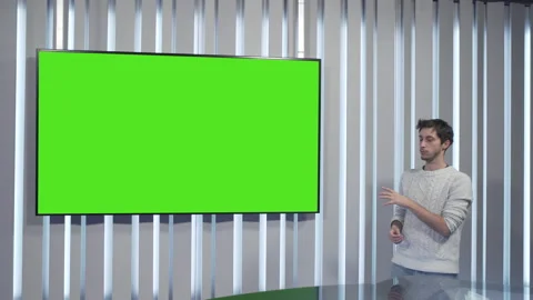 Boy shows and explains in front of a green screen Stock Footage 144246272