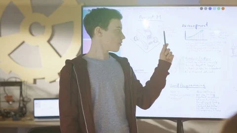 Boy Shows to the Class His Presentation on Interactive Whiteboard Stock Footage 75785728