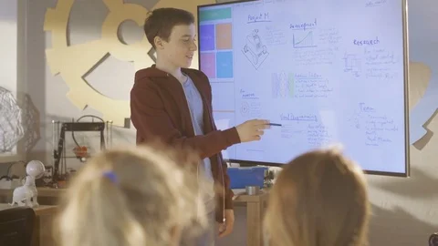 Boy Shows to the Class His Presentation on Interactive Whiteboard Stock Footage 75785769