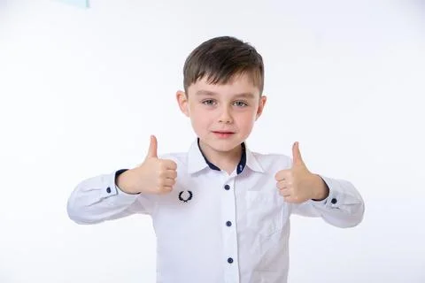  the boy shows a raised thumb up Stock Photos