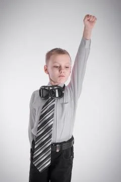 The boy shows a superhero Stock Photos