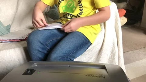 Boy Shredding Mail Stock Footage 167416934