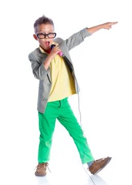 Boy singing with a microphone Fotos Stock