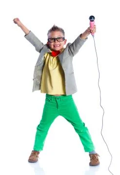 Boy singing with a microphone Photos