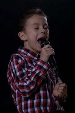 Boy singing Stock Photos