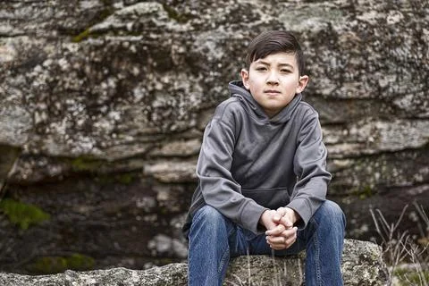 Boy sits for a rest. Stock Photos