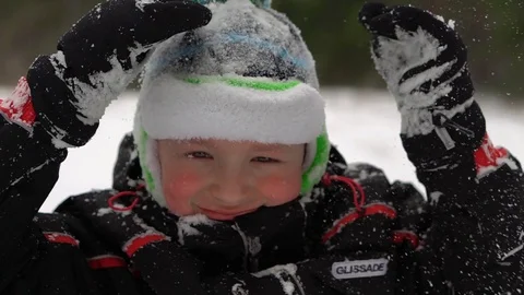 The boy sits on the snow  Stock Footage 88921429