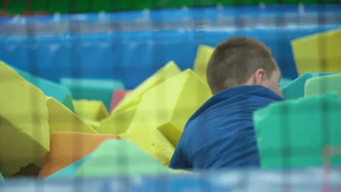 Boy sits in soft cubes Stock Footage 113911872