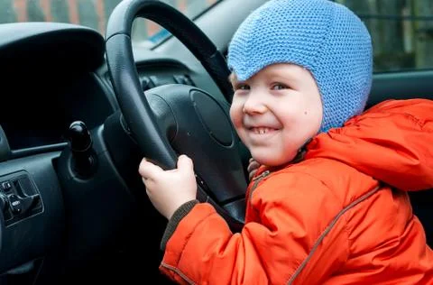 Boy sitting in the car as the driver Stock Photos