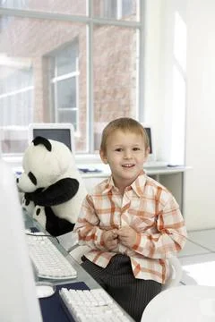  Boy sitting at computer desk Beijing China Copyright: xýxBluexJeanxImages.. Stock Photos