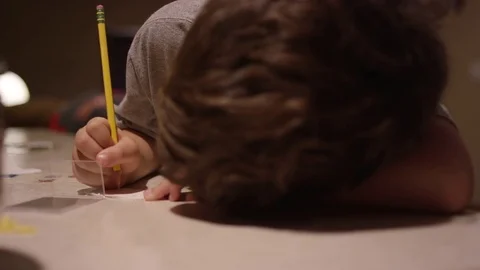 A boy sitting at the kitchen counter Stock Footage 70716829